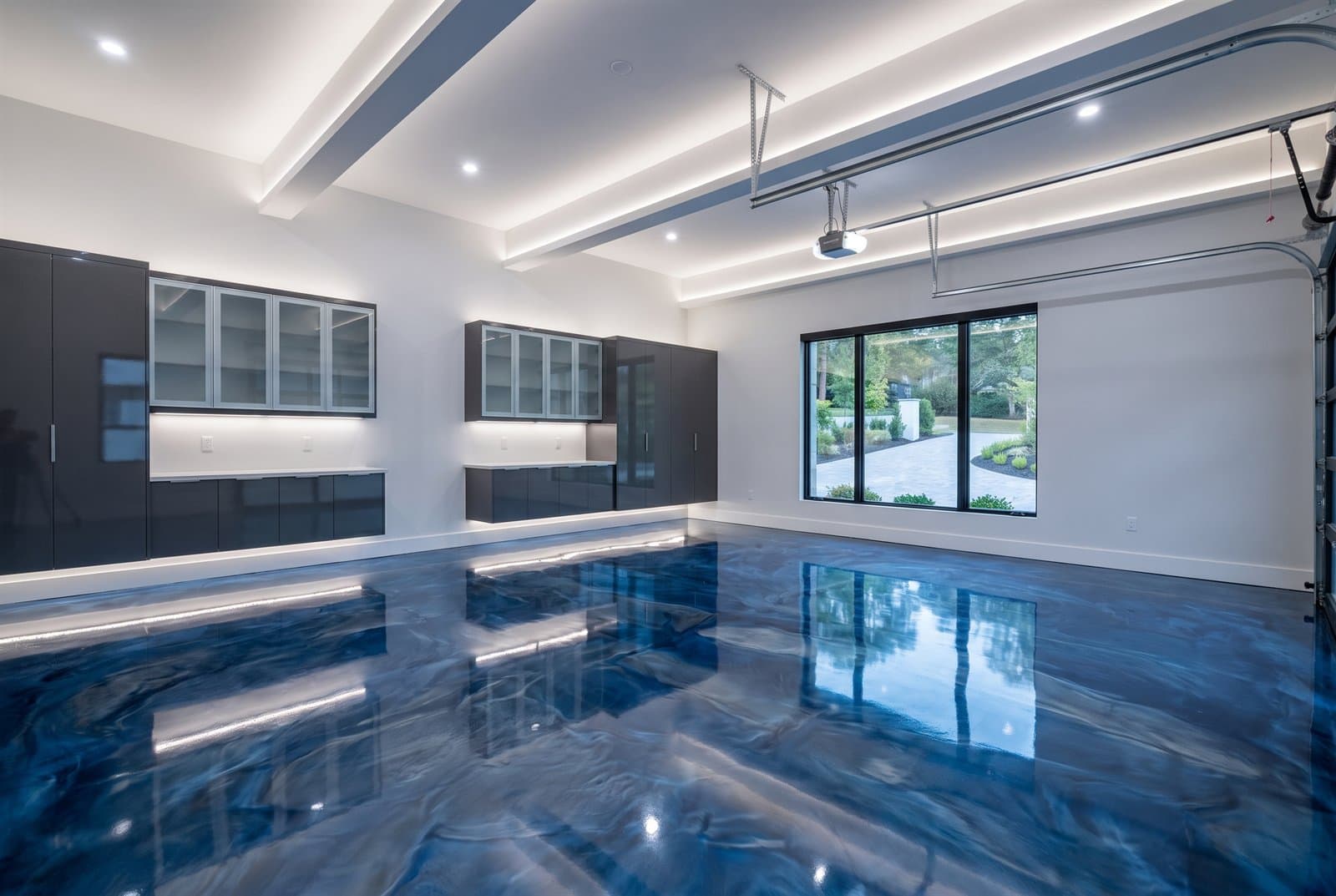 Blue and silver metallic swirl epoxy floor with glassy depth