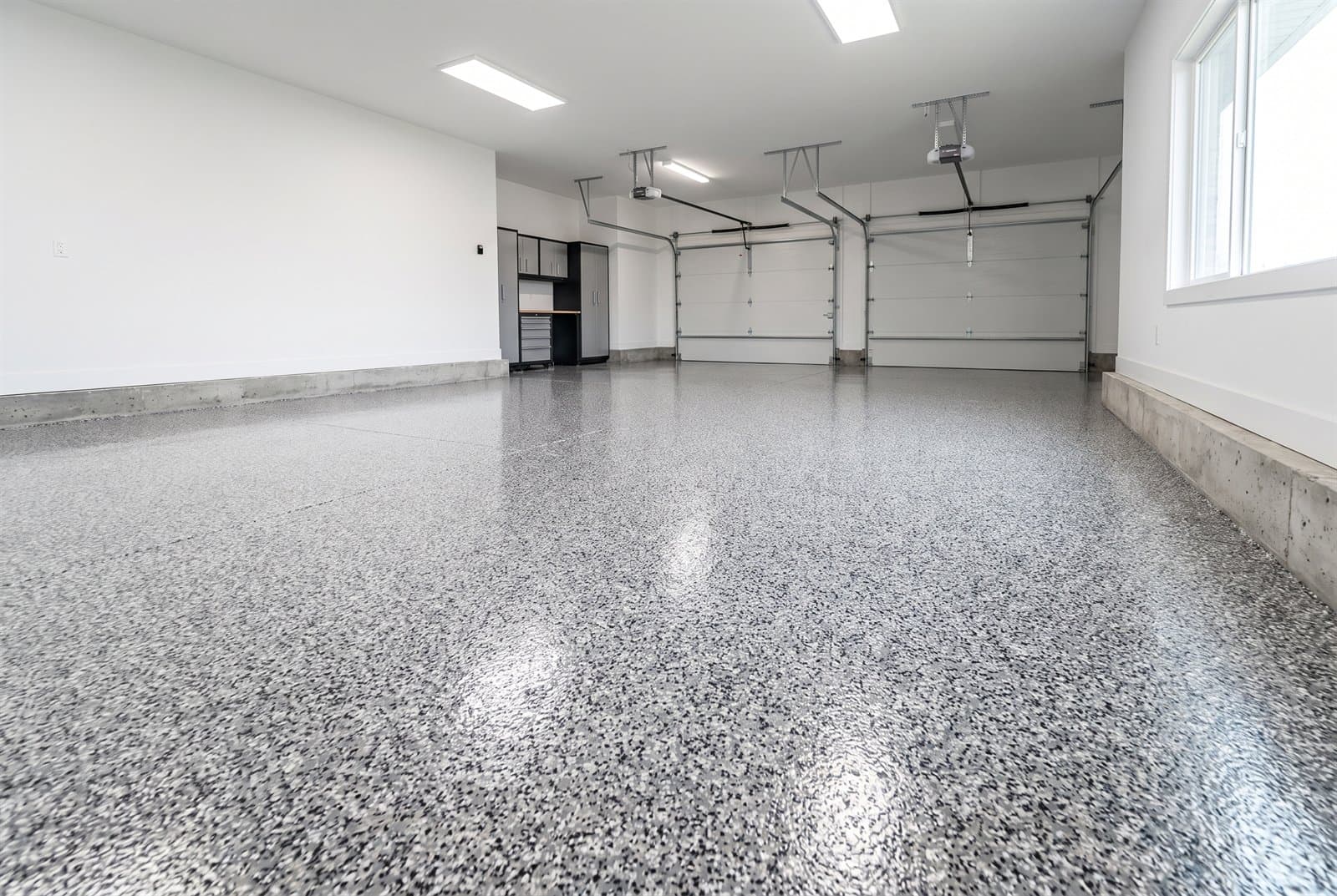 Decorative flake and chip epoxy garage floor installation
