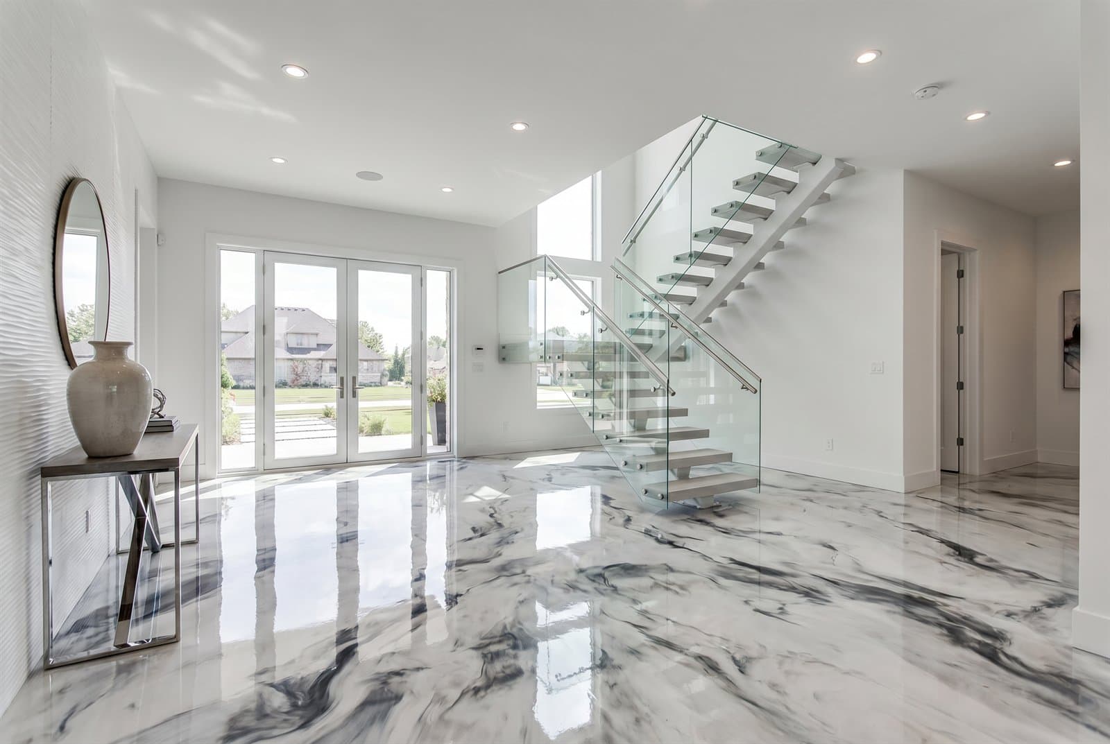 Marble-look epoxy floor with white and grey veining