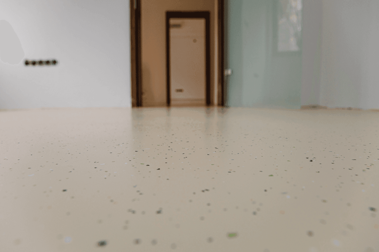 Solid slate-grey high-gloss epoxy garage floor with clean professional finish
