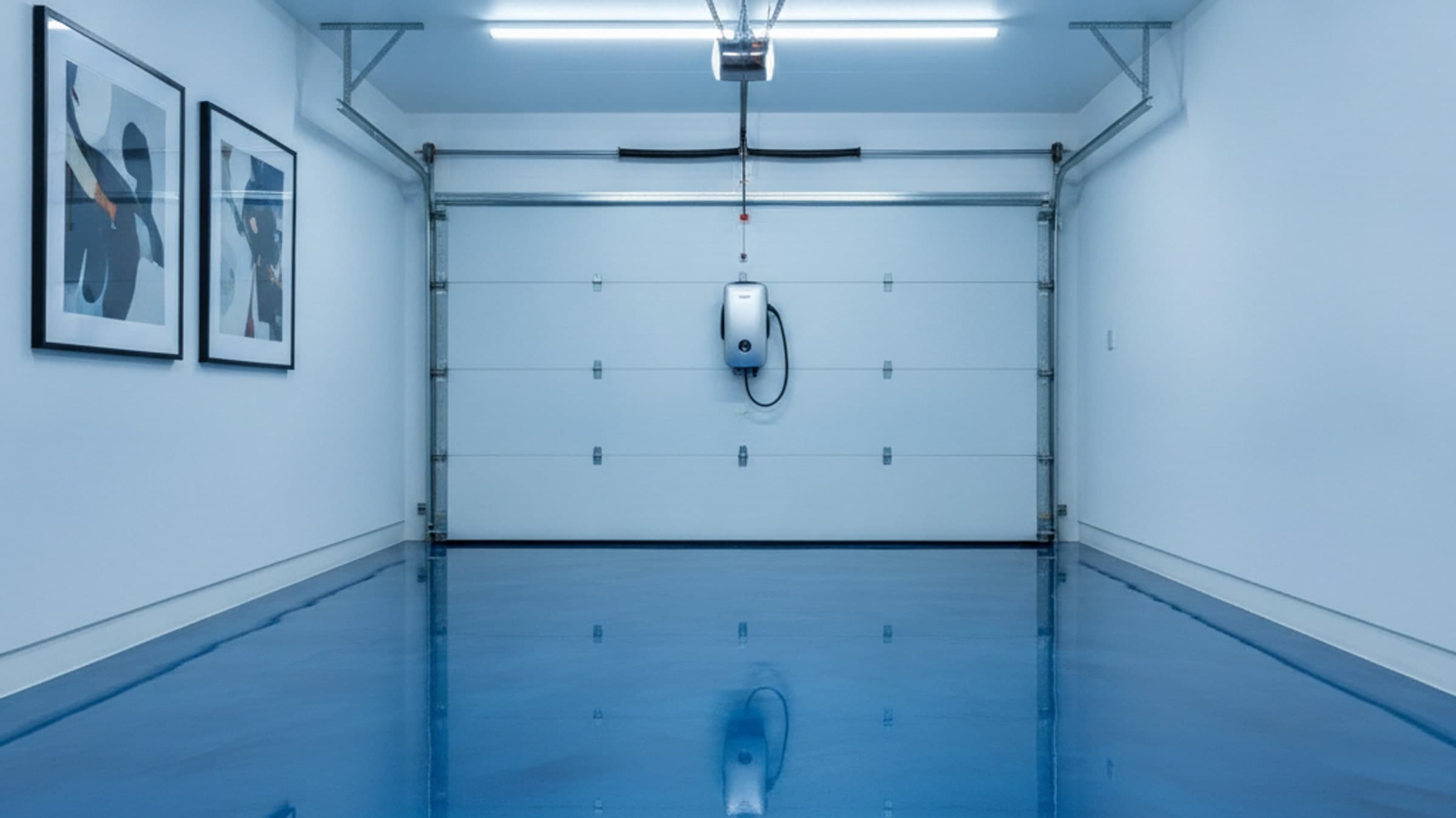 High-gloss metallic epoxy garage floor with mirror-like reflections — RamRock Coatings portfolio